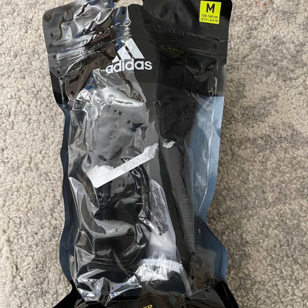 Two Medium adidas juniors soccer shin guard sock
